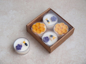"Busy Bees" Tealight Set - Unscented white soy candles decorated with wax bees, honeycomb, and purple flowers.