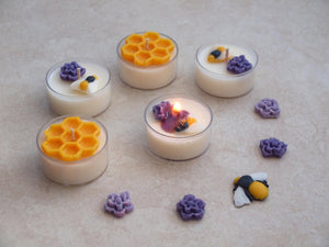 "Busy Bees" Tealight Set - Unscented white soy candles decorated with wax bees, honeycomb, and purple flowers.
