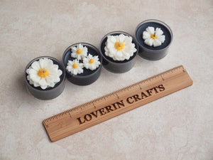 "Daisies on Black" Tealight Set - Unscented black soy candles decorated with wax daisies.