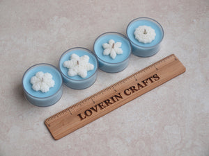 "Snow Day" Tealight Set - Unscented pale blue soy candles decorated with white wax snowflakes.
