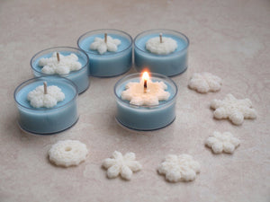 "Snow Day" Tealight Set - Unscented pale blue soy candles decorated with white wax snowflakes.