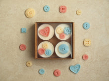 Load image into Gallery viewer, Nursery Notions Tealight Set - Miscellaneous pastel wax buttons on four white tealight candles.