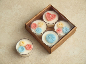 Nursery Notions Tealight Set - Miscellaneous pastel wax buttons on white tealight candles.
